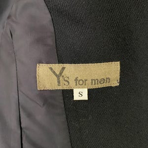 May include: A black Y's for men label with the size "S" printed on it.