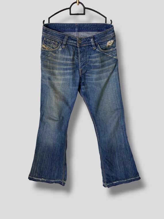 Distressed diesel jeans hotsell