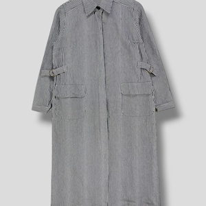 May include: A long, striped, black and white, collared shirt with a zipper closure and two pockets. The shirt has straps on the sleeves.