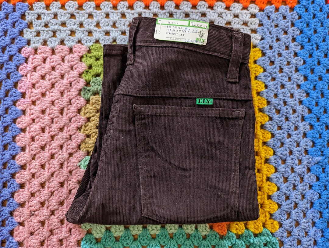 new balance minimus black and gold