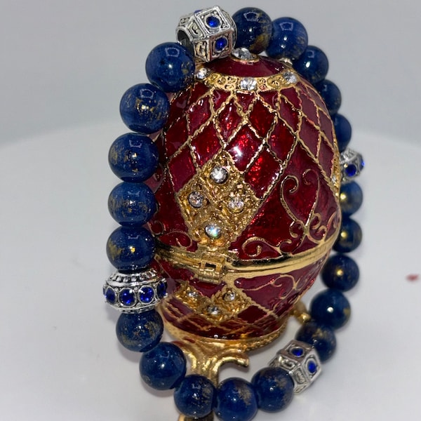 Lapiz Lazuli beads meet elegance with 4 silver spacers, each adorned with captivating blue sapphire stones. A statement of sophistication."