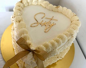Adorno para tarta Sixty Cake: decoración moderna de acrílico para tarta de 60 cumpleaños con texto en cursiva y diseño plano.