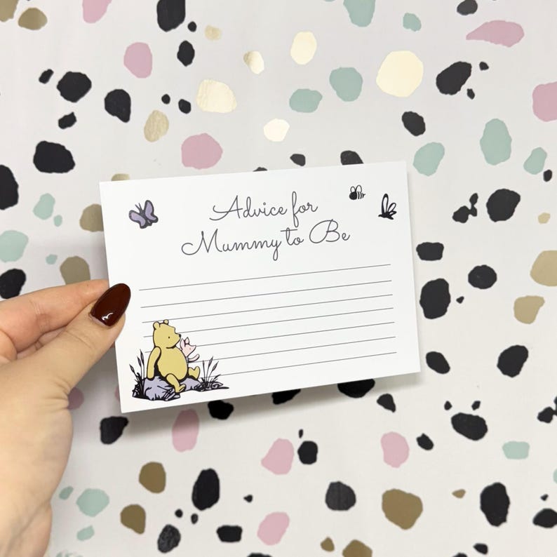 May include: A white card with black lines and a Winnie the Pooh illustration. The card says "Advice for Mummy to Be" at the top.