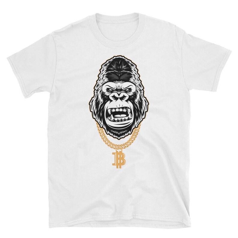 May include: A white t-shirt with a black and white illustration of a gorilla wearing a gold chain with a bitcoin pendant.