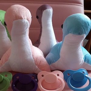 Hide away plush monster with storage pocket W adult pacifier! Secret little discreet little