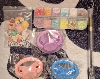 Adult pacifier DIY deco kit with pacis, gems, and gem picker!