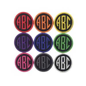 May include: Nine round embroidered iron-on patches with black borders and white lettering. The patches are in various colors: orange, yellow, green, blue, purple, pink, gray, and white.