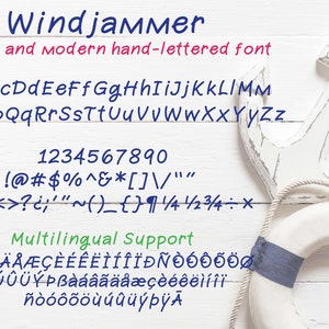 May include: A white wooden anchor and a white and blue life preserver on a white wooden background. The image includes a handwritten font called "Windjammer" with the alphabet, numbers, and punctuation.