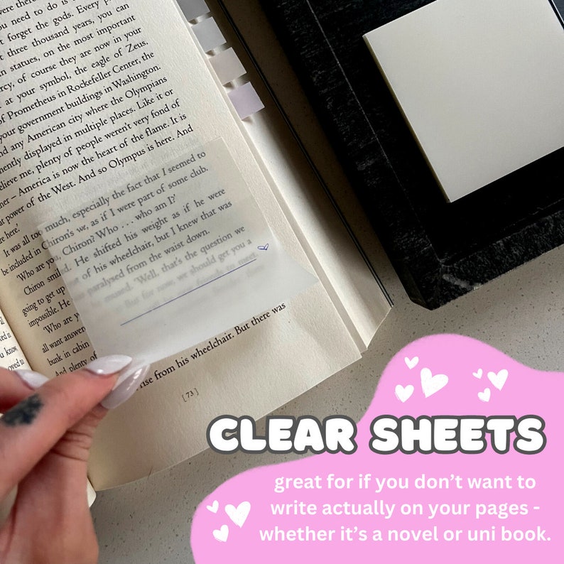 May include: Clear, transparent sheets are shown over the pages of a book. The text "CLEAR SHEETS" is displayed in a pink bubble with white hearts. The sheets are designed for writing without marking the original pages.