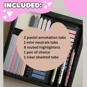 May include: A collection of stationery items including pastel annotation tabs, mini neutral tabs, muted highlighters, a pen, and clear sheeted tabs. The items are arranged in a dark wooden tray. Text on the image reads "INCLUDED:" and lists the items.