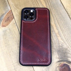 Handmade Burgundy leather iPhone case with personalization. iPhone cases include: 12, 13, 14, and 15. Phone case for men or women.
