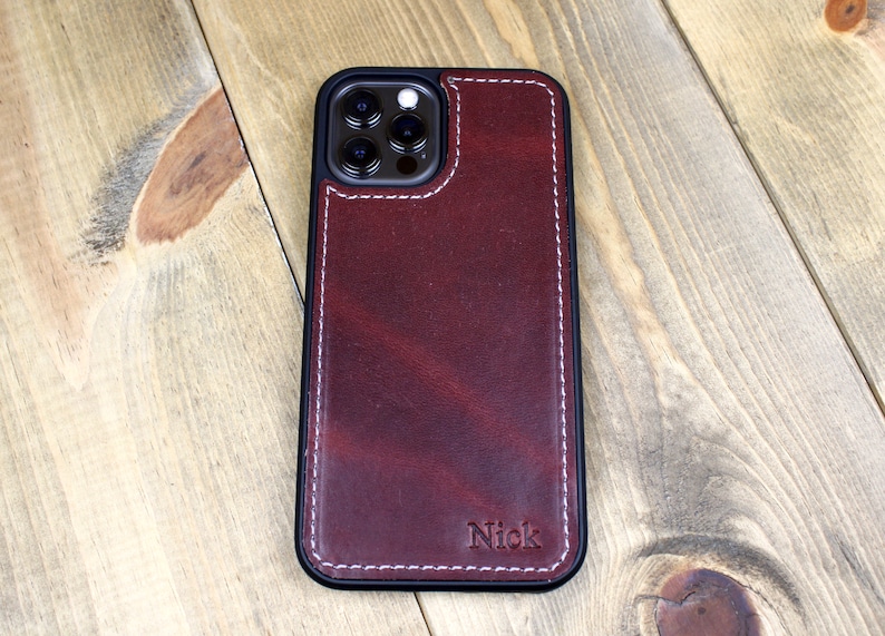 Handmade Burgundy leather iPhone case with personalization. iPhone cases include: 12, 13, 14, and 15. Phone case for men or women.