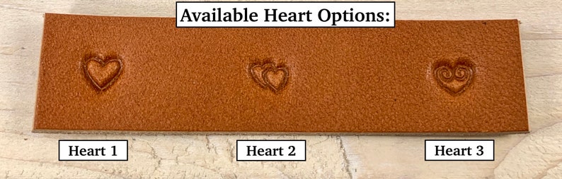 May include: Three different heart designs stamped into a piece of brown leather. The text "Available Heart Options:" is above the leather. The leather is labeled "Heart 1", "Heart 2", and "Heart 3" below each design.