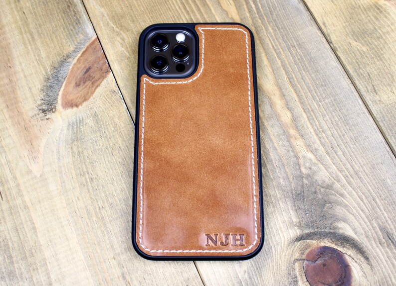 Handmade Buck Brown leather iPhone case with personalization. iPhone cases include: 12, 13, 14, and 15. Phone case for men or women.