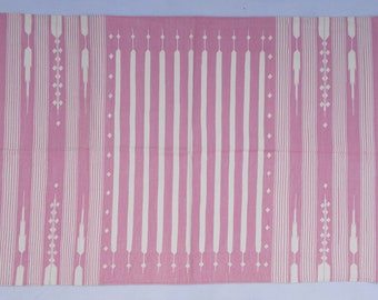 May include: Pink and white striped rug with a geometric pattern. The rug has a fringe border.