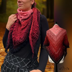 Peut inclure: Un châle fait à la main, crocheté en rose, rouge et noir. Le châle présente un effet de couleur dégradé et des détails de dentelle complexes. Le design est présenté sur un mannequin et porté par une personne, mettant en valeur le drapé et le style du châle.