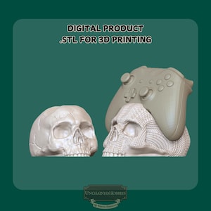 May include: A digital product .STL for 3D printing featuring two light-coloured skulls. One skull is smooth and realistic, while the other has a textured surface and serves as a stand for a gaming controller. The text reads DIGITAL PRODUCT .STL FOR 3D PRINTING.