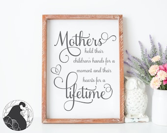 A Mother holds her children/'s hands for a short while but their hearts forever,mom,Mothers Day,holding hearts of children,mother child love