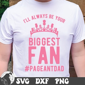 May include: White t-shirt with pink text that reads "I'll always be your biggest fan #pageantdad". A pink crown is above the text.