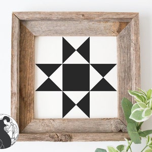 May include: A framed black and white geometric quilt block pattern with a star design. The frame is made of rustic wood.