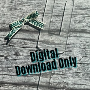 May include: A transparent fork-shaped design with the text "Digital Download Only" in black and teal. A small white and green ribbon with a leaf pattern is placed near the top of the image. The background is a grey wood grain.