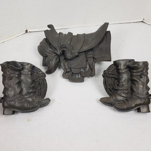 wall hanging molded resin 2 pair boots and saddle 3 piece.