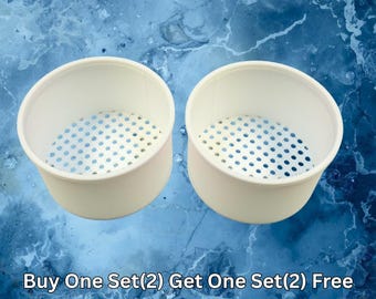 May include: Two white cylindrical containers with perforated bases, featuring a grid of small circular holes at the bottom of each vessel. The text Buy One Set(2) Get One Set(2) Free is printed in white at the bottom of the image.