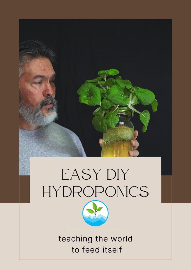 May include: A man looks intently at a glass jar with a leafy green plant growing hydroponically inside. The jar is filled with water and the plant has long roots. The text "EASY DIY HYDROPONICS" is displayed above the jar, with a logo of a green plant growing out of blue water waves below the text. The text "teaching the world to feed itself" is displayed below the logo.
