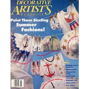 May include: A magazine cover for Decorative Artist's Workbook, featuring a summer fashion theme. The cover shows various clothing items, including shirts, shoes, and a hat, decorated with nautical and patriotic designs. The text on the cover reads "Paint These Sizzling Summer Fashions!" and "Stars & Stripes Ensemble".