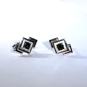 May include: A set of three ceramic mugs with a speckled, matte finish. The mugs are in shades of cream, light gray, and dark gray. Each mug has a simple, modern design and a rounded handle. Perfect for coffee or tea.