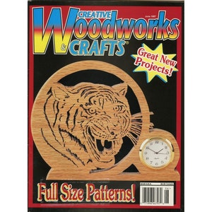 May include: A magazine cover for "Creative Woodworks & Crafts" features a wooden tiger clock. The clock has a round face with a gold bezel and Roman numerals. The magazine cover has the text "Great New Projects!" and "Full Size Patterns!"