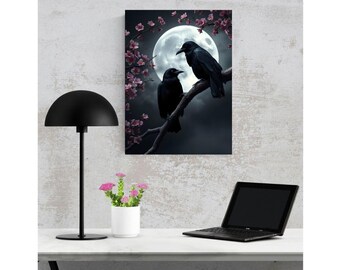 May include: A rectangular wall art print featuring two black crows perched on a tree branch against a large, bright full moon. Pink cherry blossoms surround the birds, set against a dark, moody sky. The artwork is displayed on a textured wall.