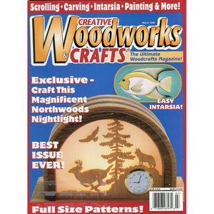 May include: The cover of Creative Woodworks & Crafts magazine features a wooden nightlight with a Northwoods theme. The nightlight has a deer, wolf, and tree design. The magazine's title is in large, colorful letters.