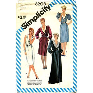 May include: Simplicity sewing pattern number 6208 for a dress. The pattern includes four different styles of dresses, including a white dress with a V-neck, a burgundy dress with a wrap neckline, a blue and white striped dress with puffed sleeves, and a black dress with a lace collar.