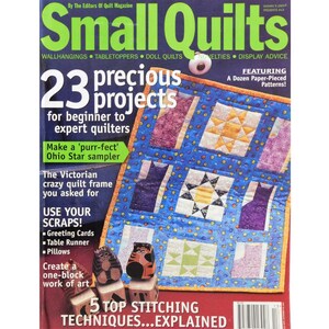 May include: A magazine cover for Small Quilts featuring 23 precious projects for beginner to expert quilters. The cover features a colorful quilt with a variety of patterns, including stars, squares, and triangles. The magazine also includes a 'purr-fect' Ohio Star sampler, a Victorian crazy quilt frame, and instructions on how to use scraps for quilting.