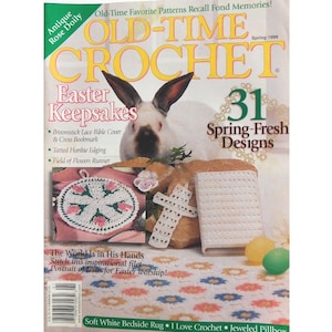 May include: A vintage crochet magazine cover featuring a white rabbit with brown ears. The cover includes the text "OLD-TIME CROCHET" and "Easter Keepsakes." It showcases crochet projects like a Bible cover and cross bookmark.