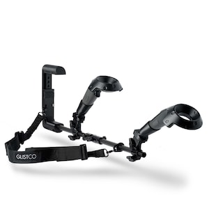 May include: Black VR controller holder with a strap and two adjustable arms for holding VR controllers. The holder is designed to be worn on the body and allows for hands-free use of VR controllers.