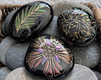 Set of 3. Flower. Tiny vines. Leaf. Hand painted Lake Superior stones. Sizes range from 3.5-4.5 inches.