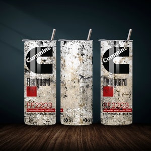 May include: Three stainless steel tumblers with a distressed white and gray background. The tumblers feature the Cummins logo and the text "Fleetguard" and "FF2203 Extended Service Fuel Filter Cummins 4010476".