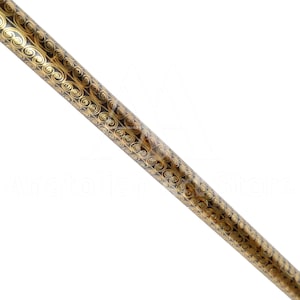 May include: A close-up of a black and gold decorative walking stick with a swirling pattern.