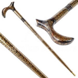 May include: A wooden walking stick with a curved handle. The handle and shaft are decorated with intricate gold swirls.