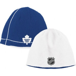 May include: Reversible knit beanie hat with a blue side featuring the Toronto Maple Leafs logo and a white side with the NHL logo.