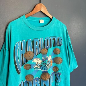 Charlotte Hornets Logo T-Shirt from Homage. | Teal | Vintage Apparel from Homage.