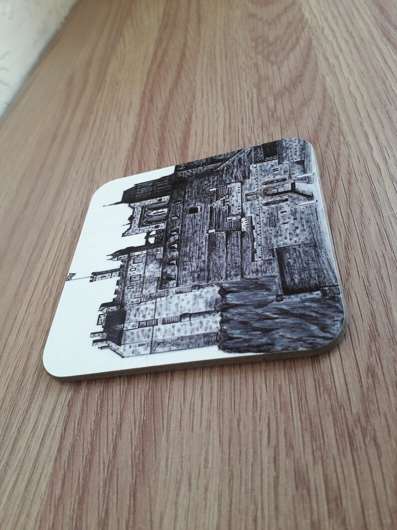 Art coaster featuring print of pen and ink drawing of Edinburgh Castle.