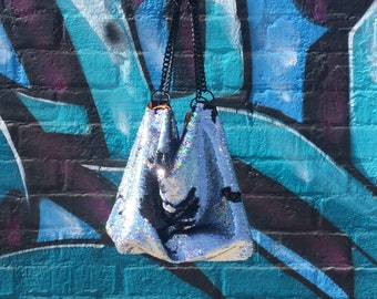 Cocoon (Bling)- Reversible sequins slouch shoulder bag with micro glitter leather and chain strap and scuba lining.