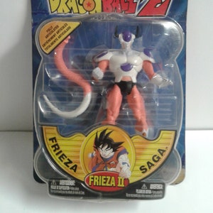 May include: A Dragon Ball Z action figure of Frieza in his second form. The figure is fully articulated and comes with a tail. The packaging features a blue and white background with the Dragon Ball Z logo. The text on the packaging reads "Frieza Saga" and "Frieza II".