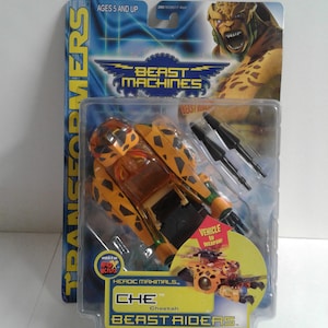以下が含まれることがあります： 黄色と黒の車に変形するおもちゃのロボット。おもちゃはトランスフォーマーのビーストマシンシリーズの一部です。パッケージには「ビーストマシン」と「ビーストライダー」の文字が書かれています。