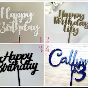May include: Four cake toppers made of acrylic. The first topper is silver and says "Happy Birthday". The second topper is gold and says "Happy Birthday Lily". The third topper is black and says "Happy Birthday". The fourth topper is blue and says "Callum is 13".