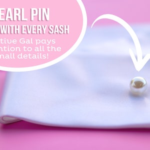 May include: A white satin sash with a pearl pin attached. The text "PEARL PIN COMES WITH EVERY SASH Festive Gal pays attention to all the small details!" is visible in the image.