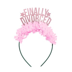 May include: Pink and gold glitter headband with the text "FINALLY DIVORCED" on it. The headband is decorated with pink tissue paper.